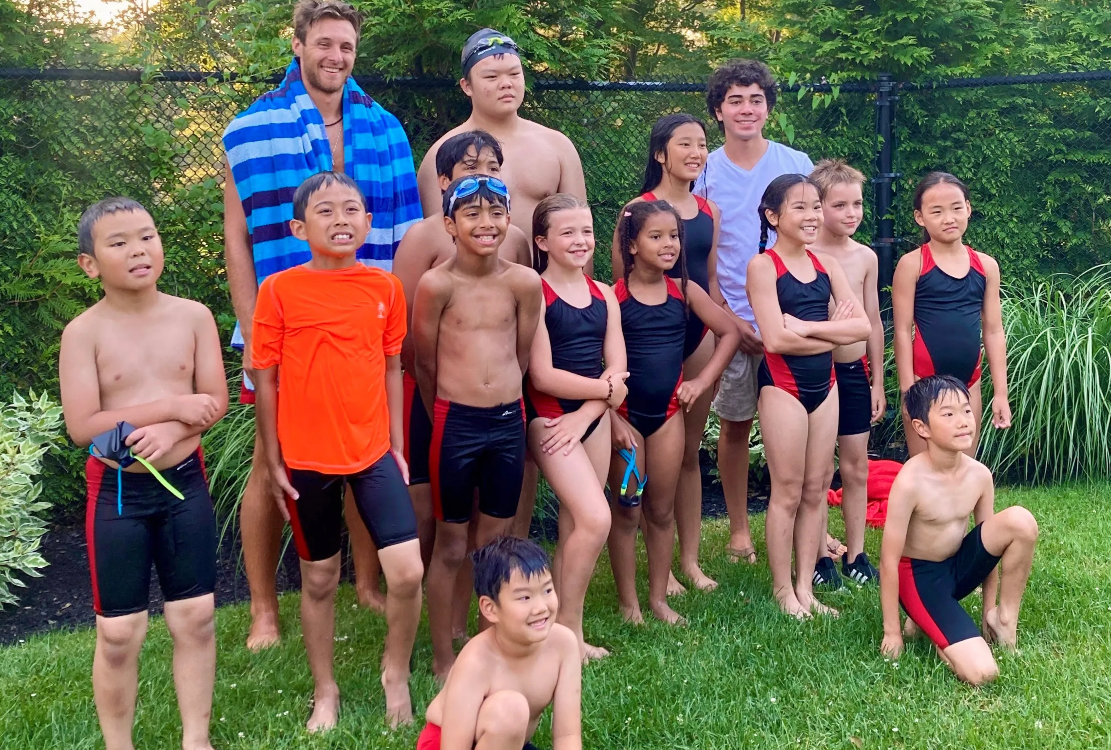 group photo of youth swim team smiling