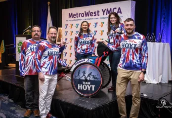 Members of the Hoyt Family pose with Rick Hoyt's wheelchair