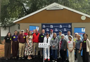 A group of state leaders in the education and agriculture space gather at the MetroWest YMCA Outdoor Center for a Farm-to-School demonstration