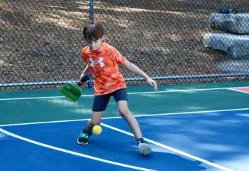 boy playing pickleball