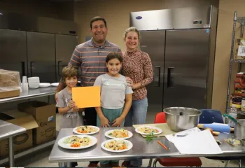 photo of family at cooking class