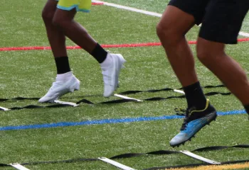 up close image of two people on sports field