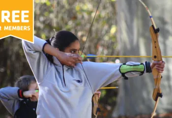 young female holding bow and arrow