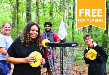 MetroWest YMCA staff and teen members playing Disc Golf at Hopkinton Outdoor Center