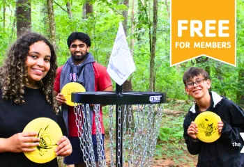 MetroWest YMCA teen members playing Disc Golf at Hopkinton Outdoor Center