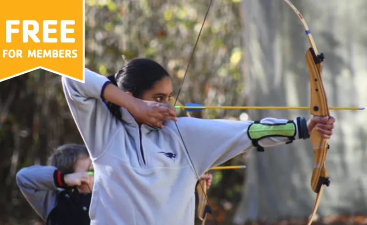 young female holding bow and arrow