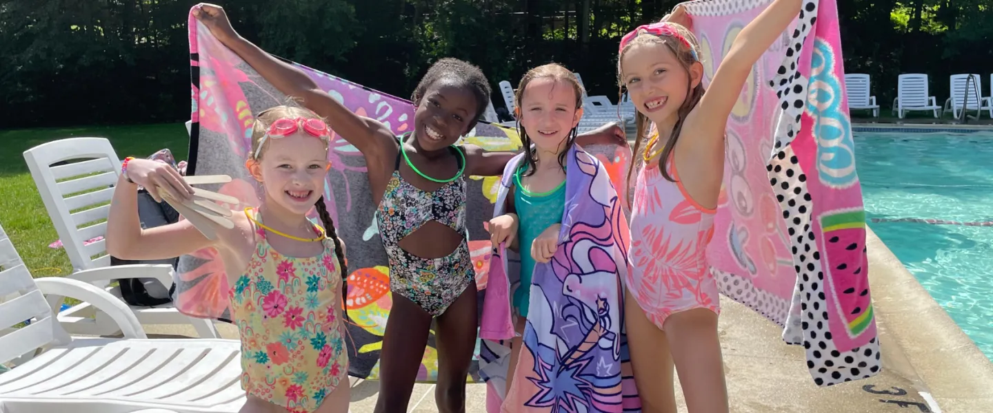 Bathing beauties! Four girls strike a pose post-swim
