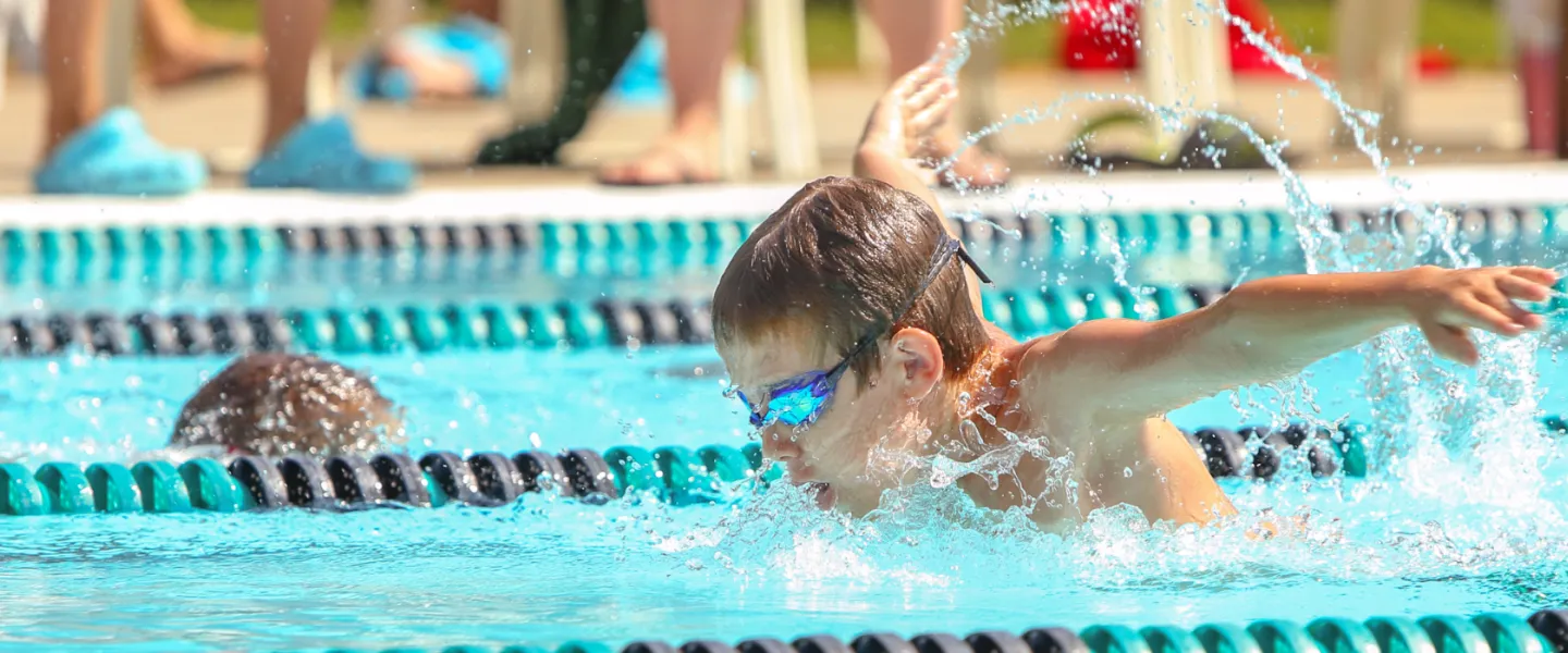 young boy swimming