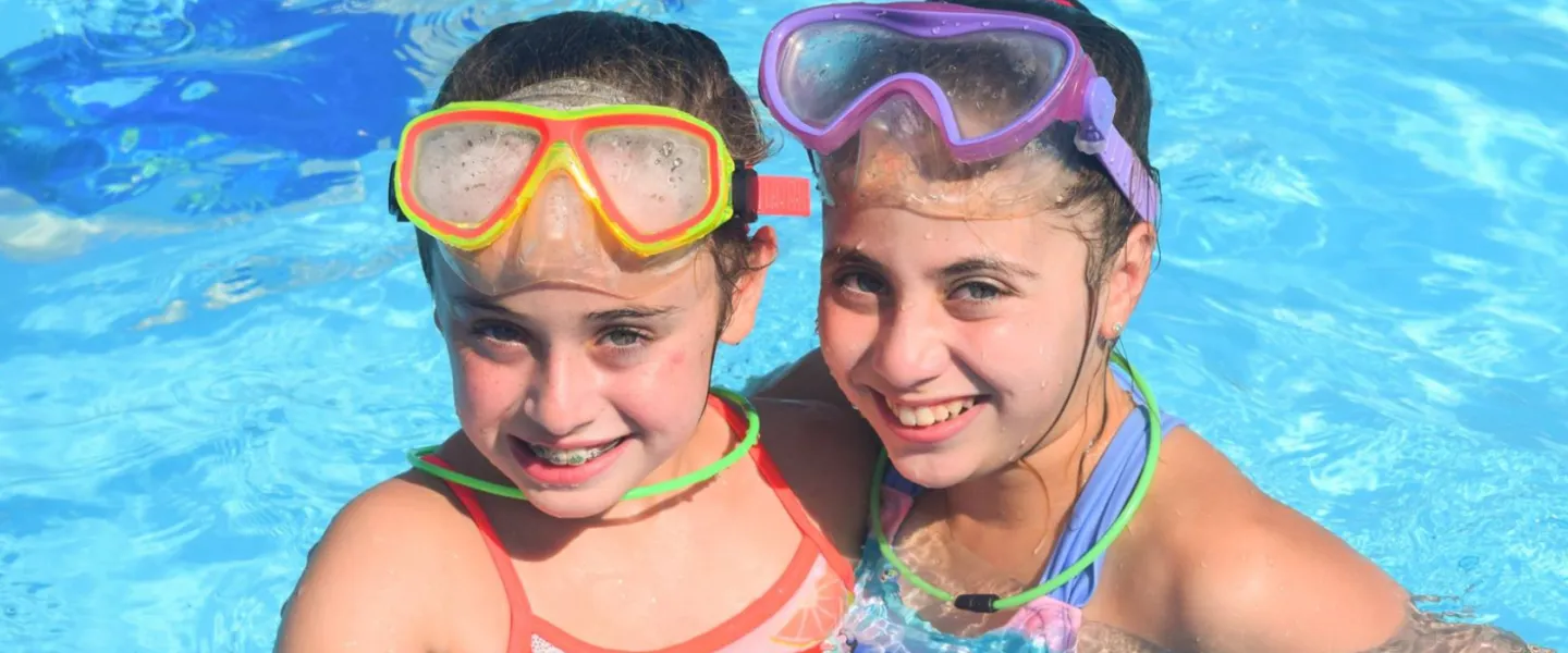 image of two girls in the pool