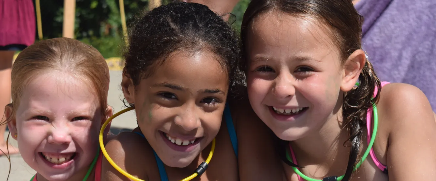 image of three young girls smiling