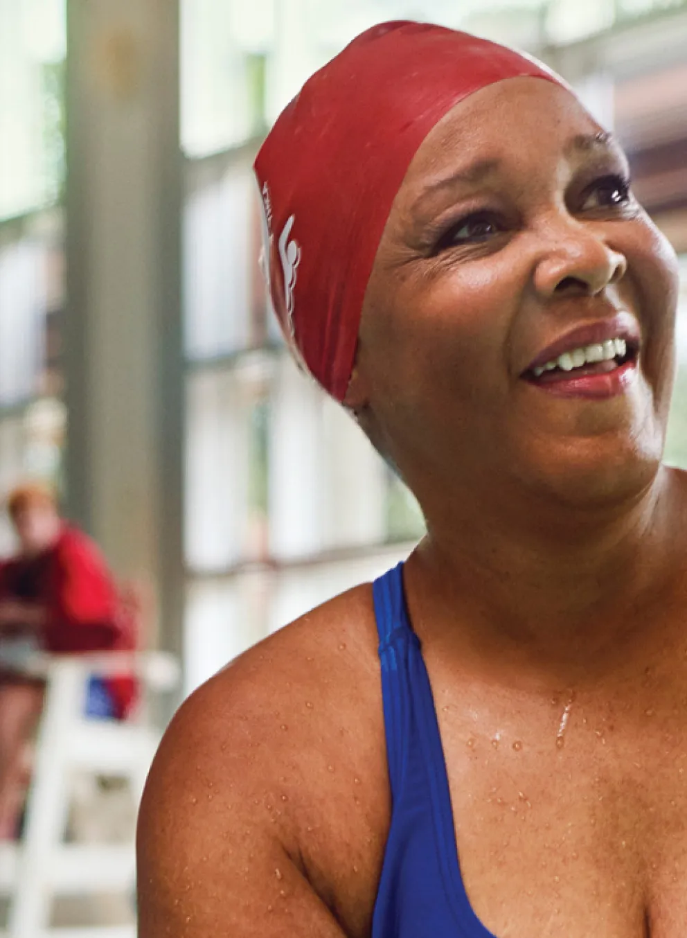 woman in pool smiling