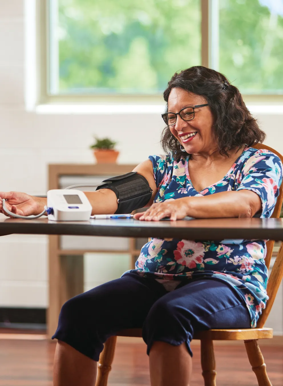 woman taking her blood pressure