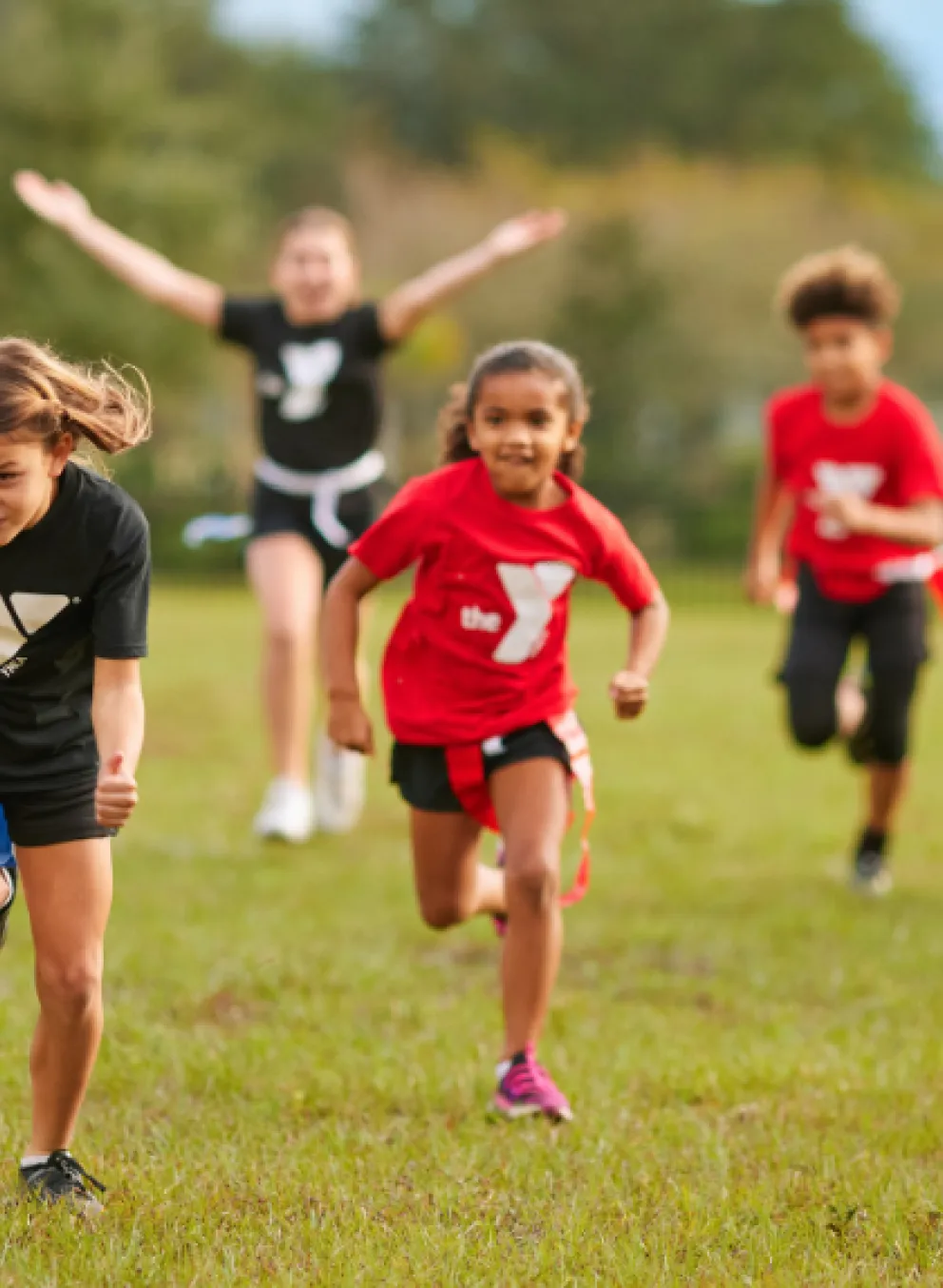 youth playing flag football