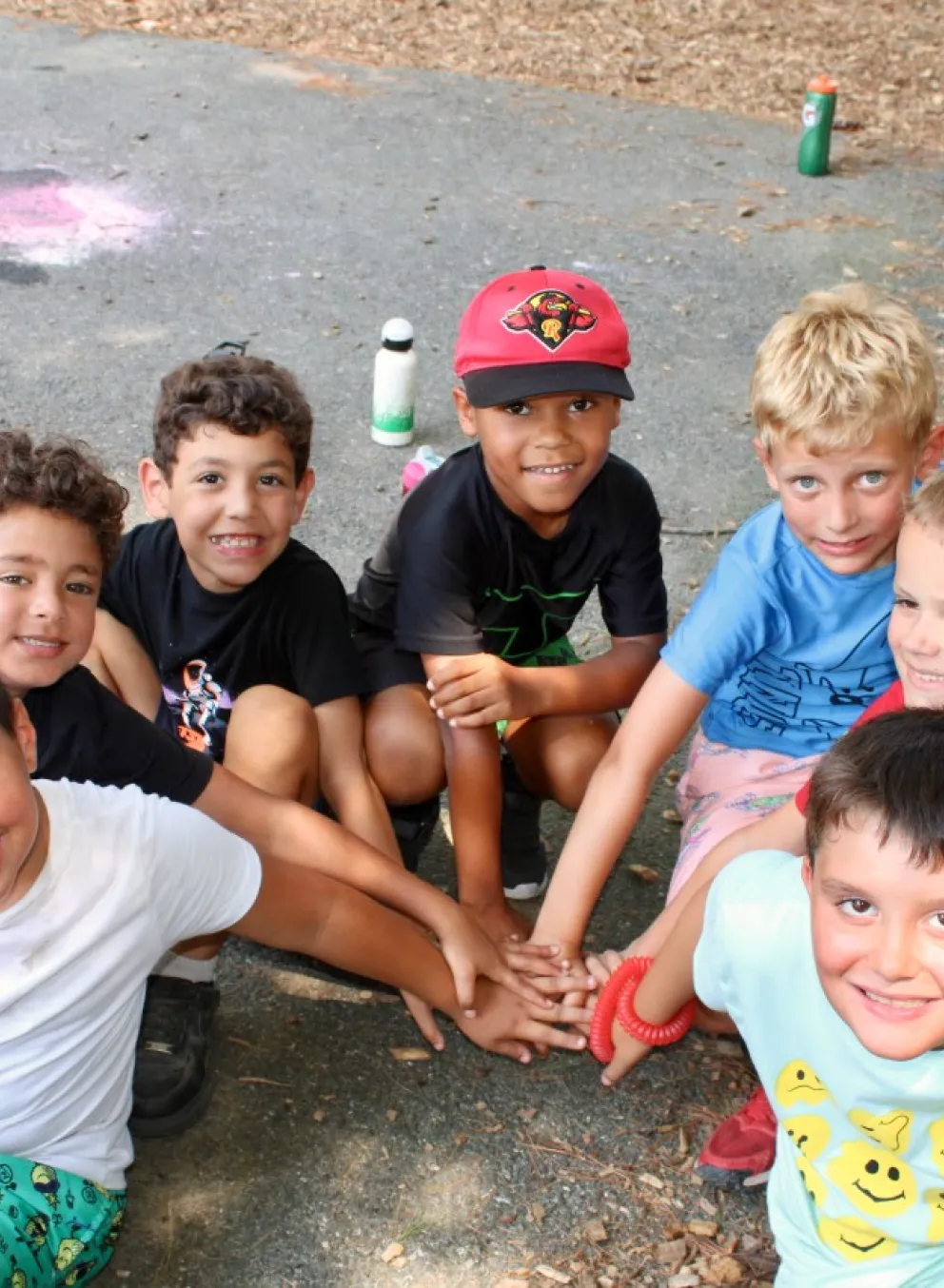 group photo of young boys outside at camp