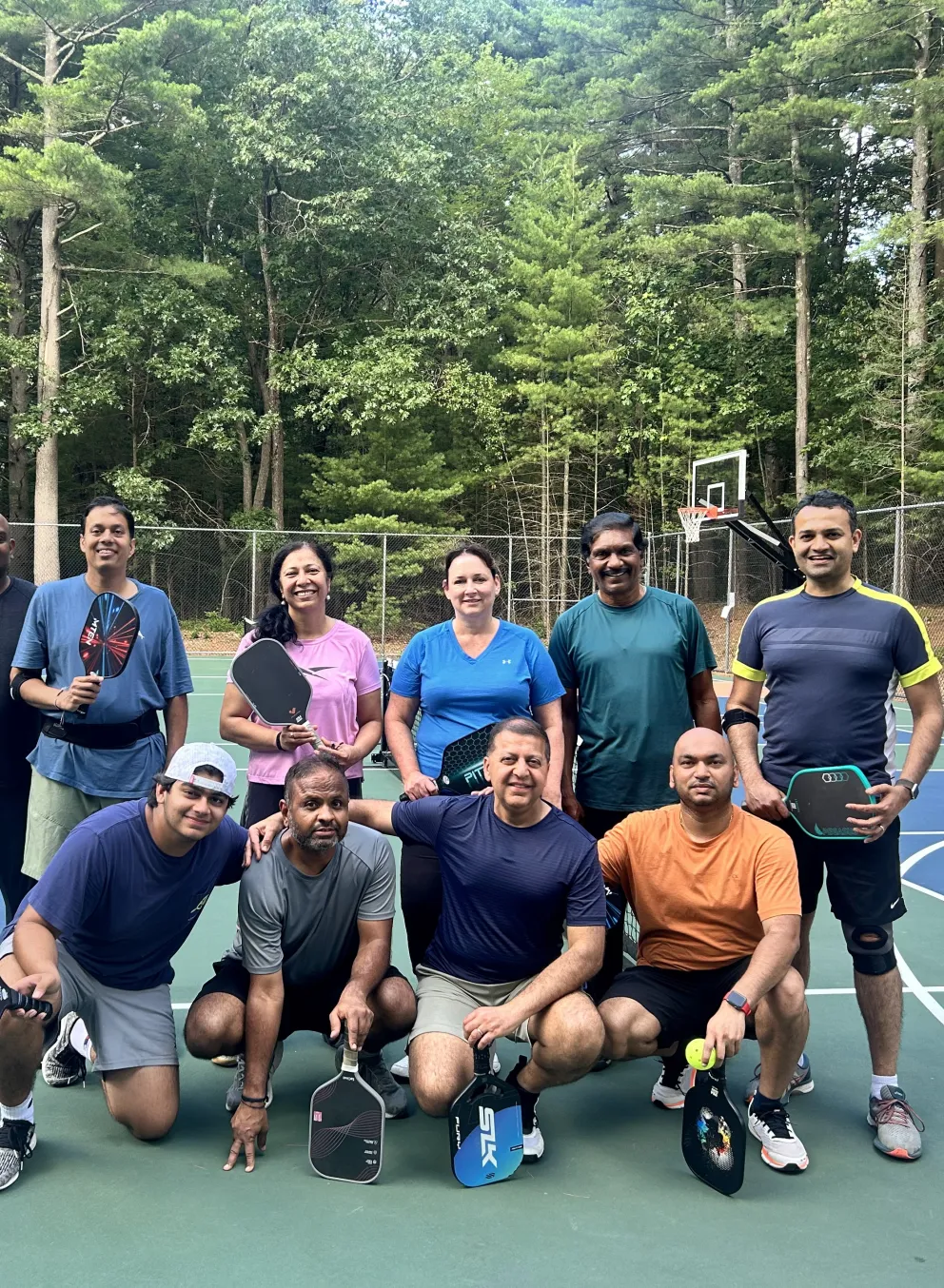 neighbors play pickleball on our outdoor courts