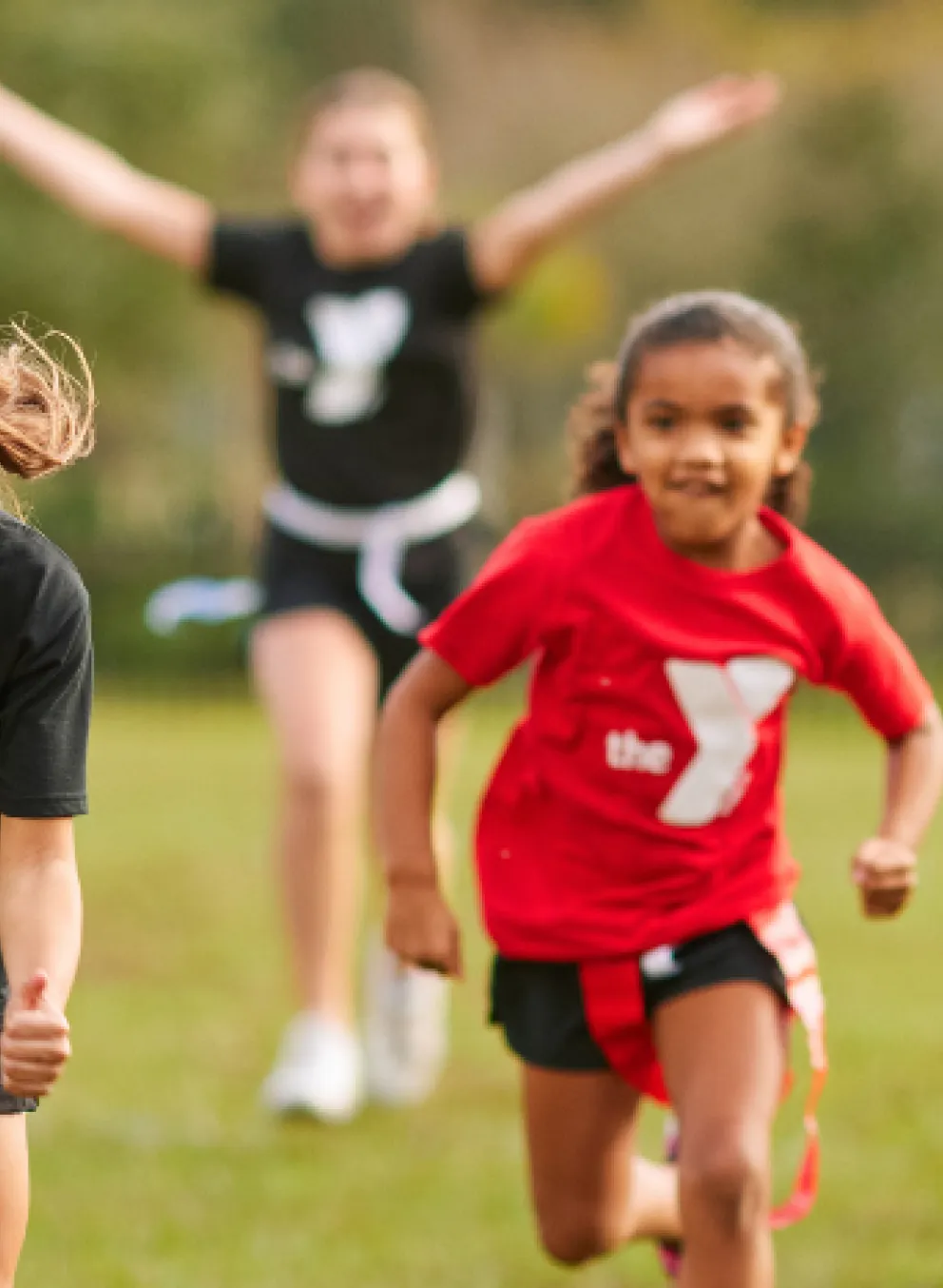 School aged children active playing outdoor football