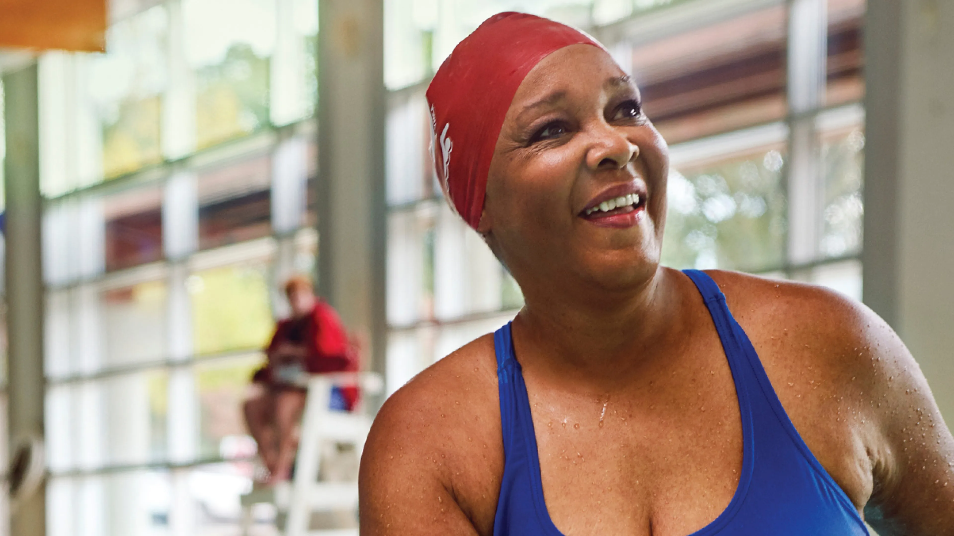 woman in pool smiling