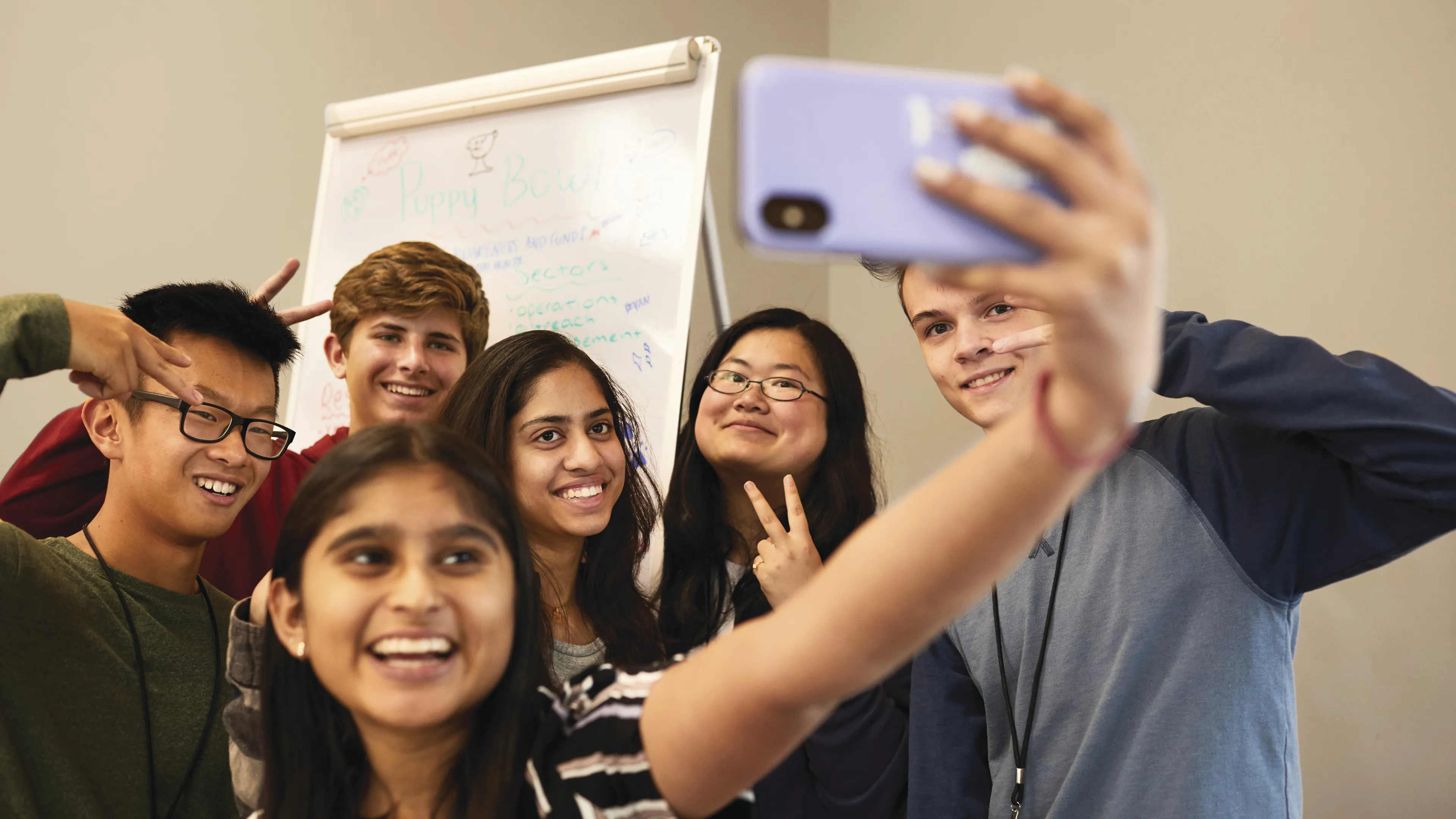 group of teenage friends taking a selfie