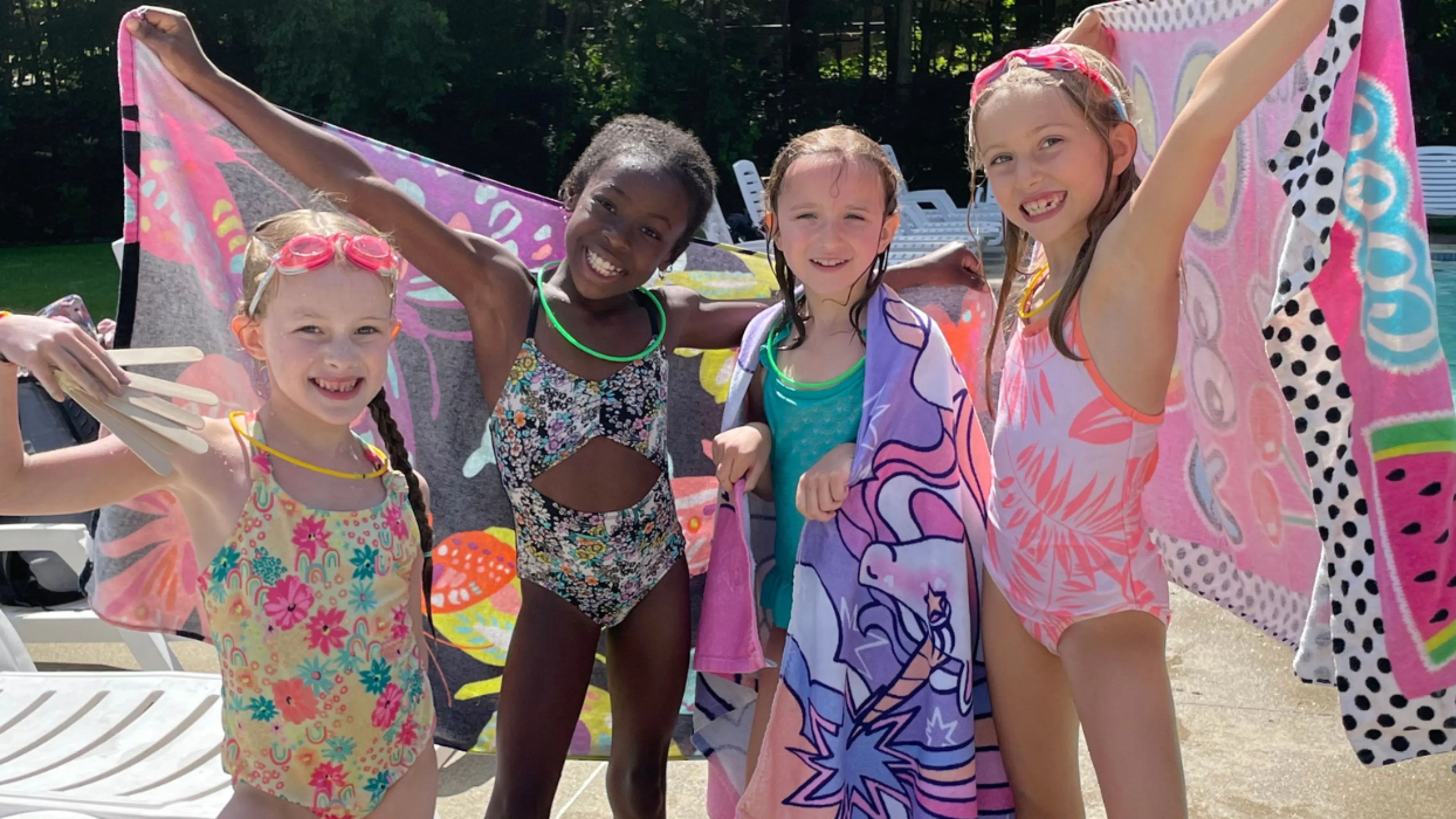 Bathing beauties! Four girls strike a pose post-swim