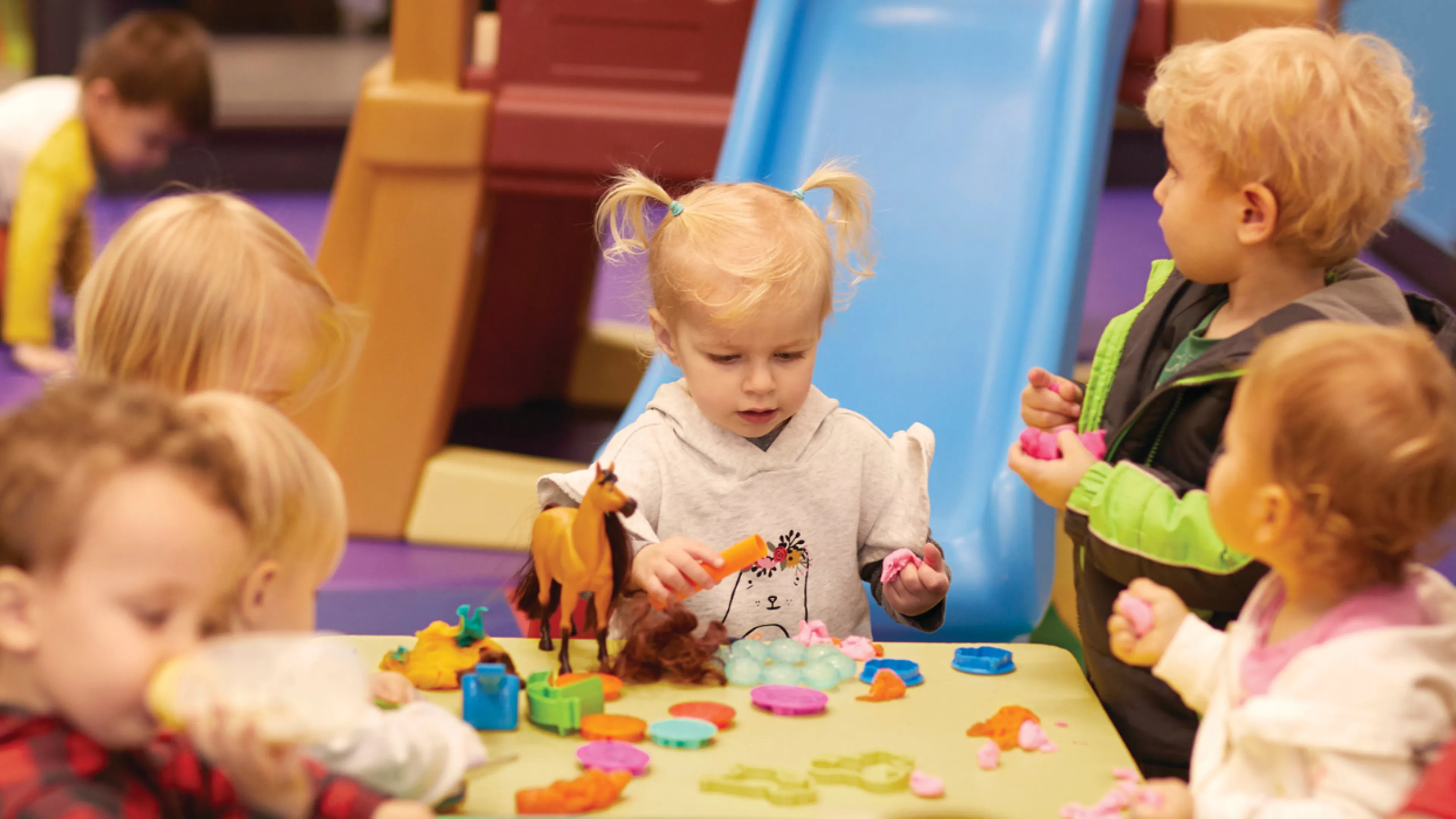 group of toddlers playing and learning