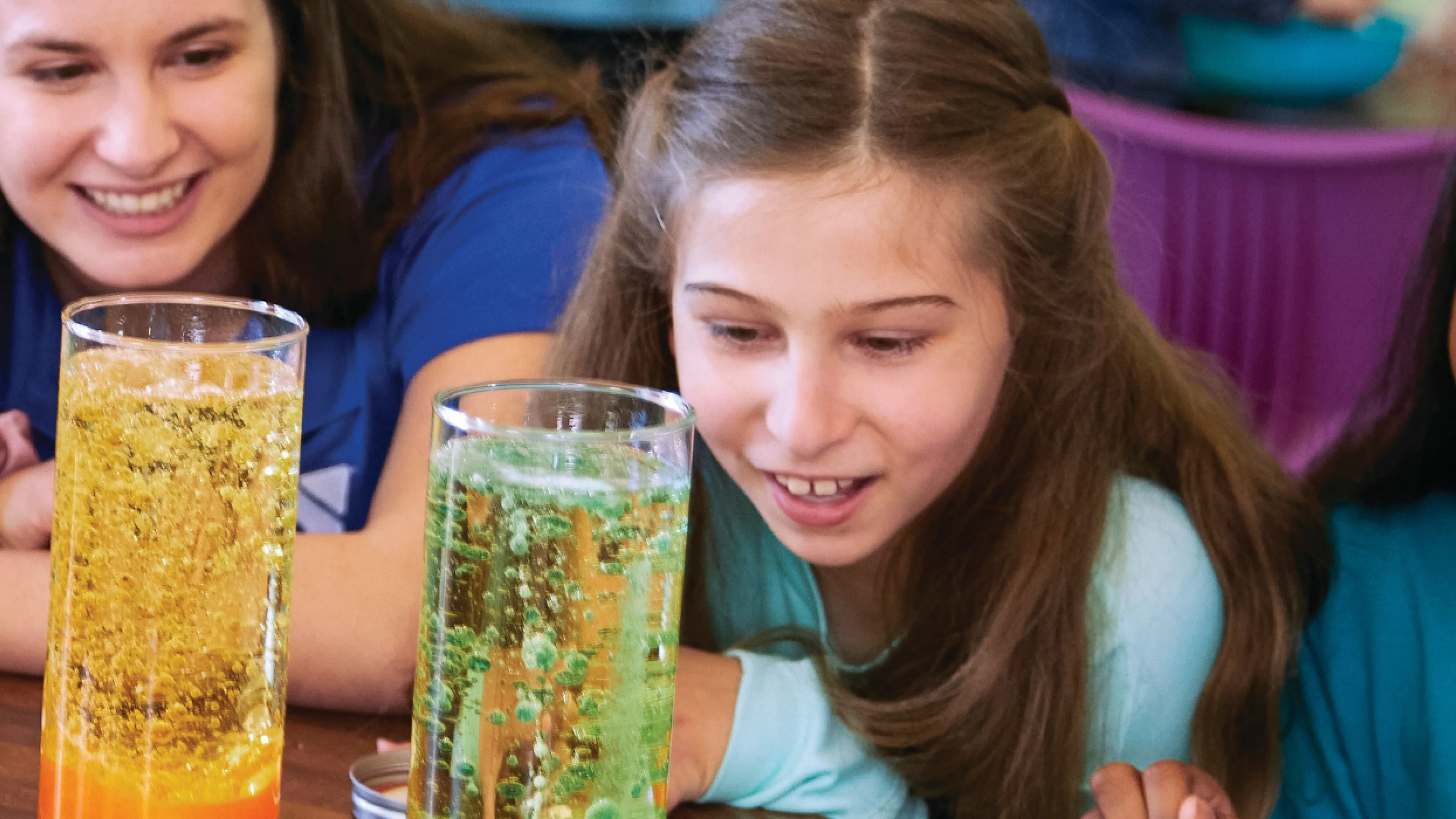 up close image of students looking at science experiment