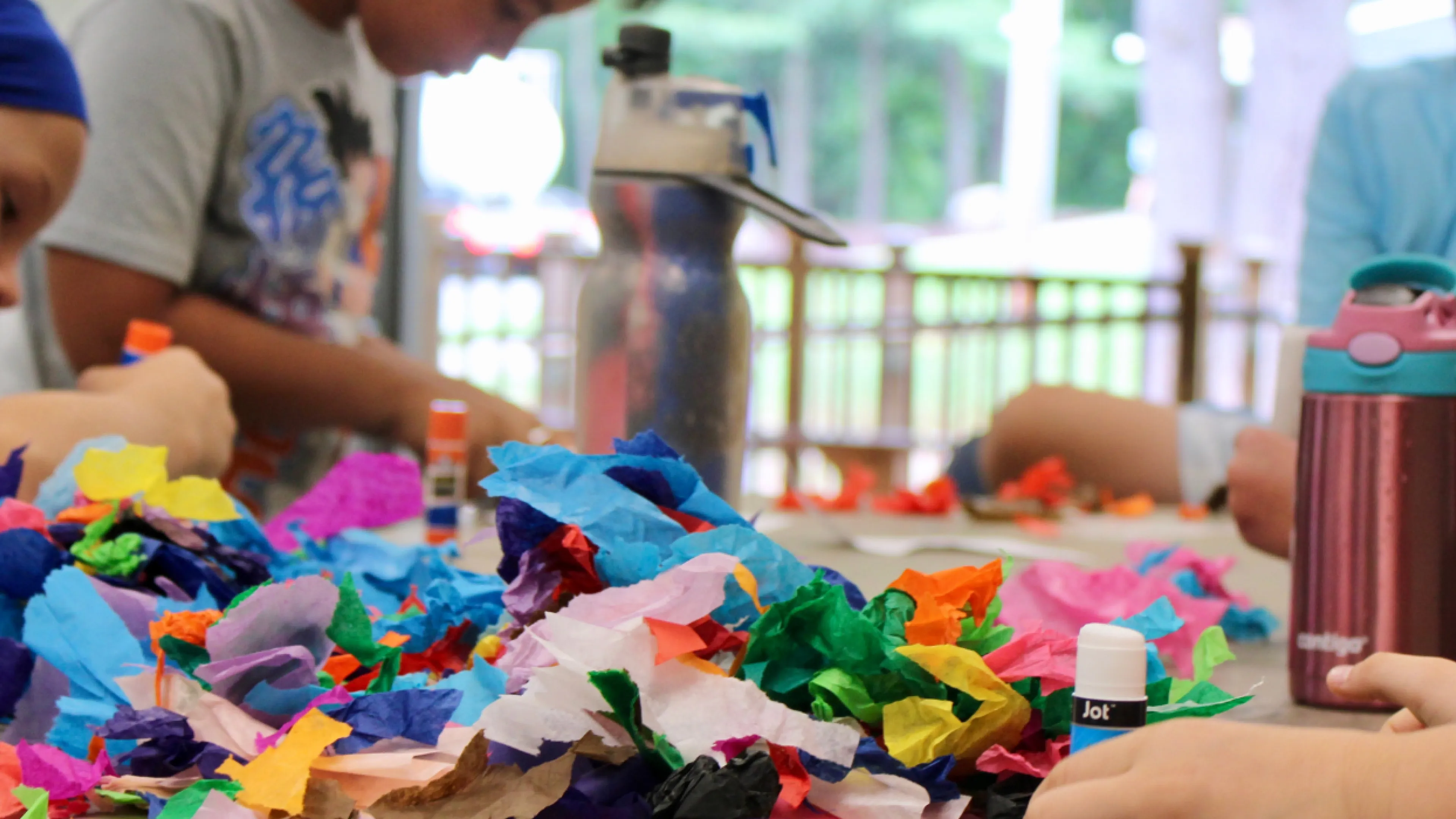 close up image of kids doing arts & crafts