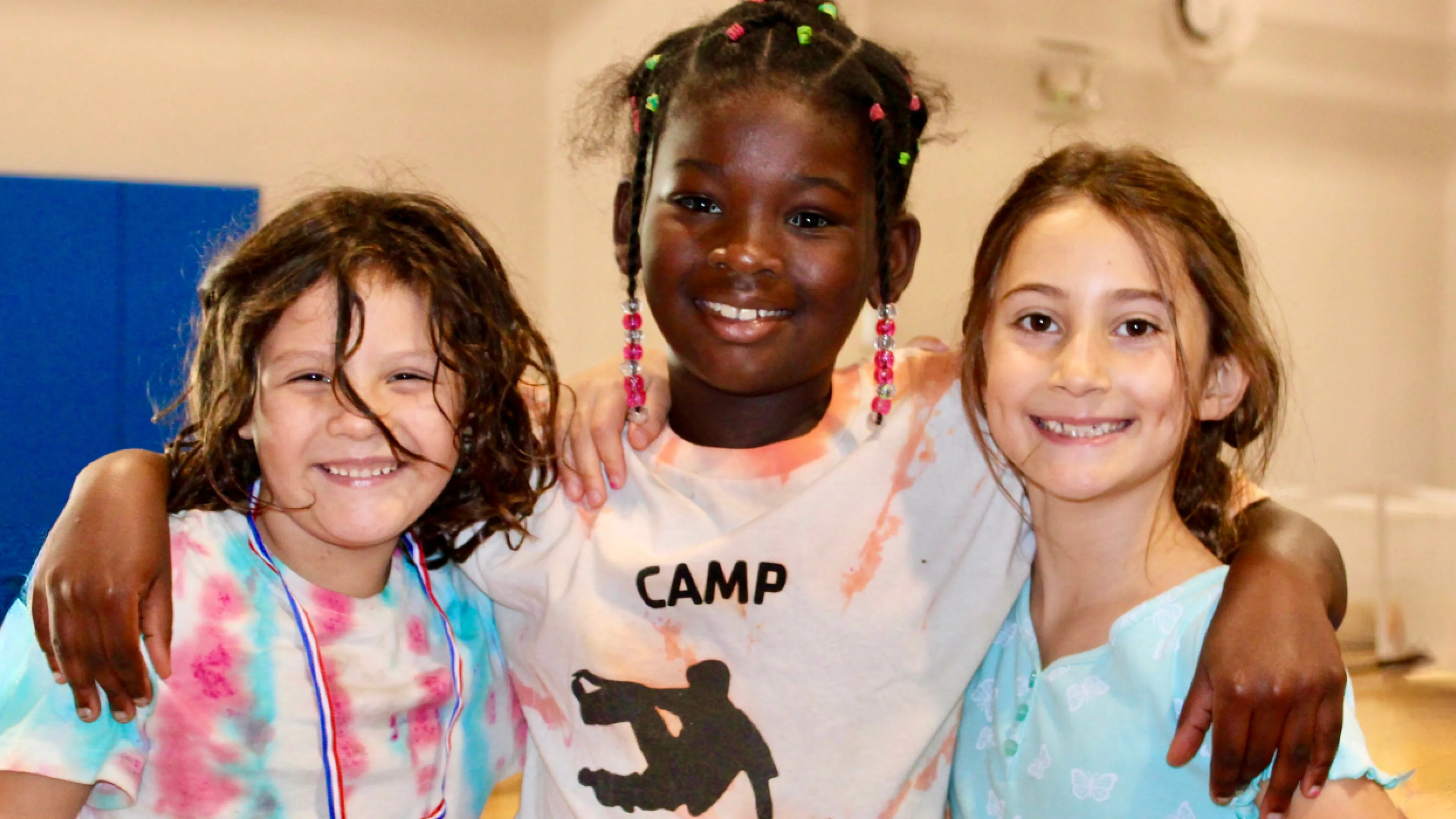 image of three girls smiling at the camera