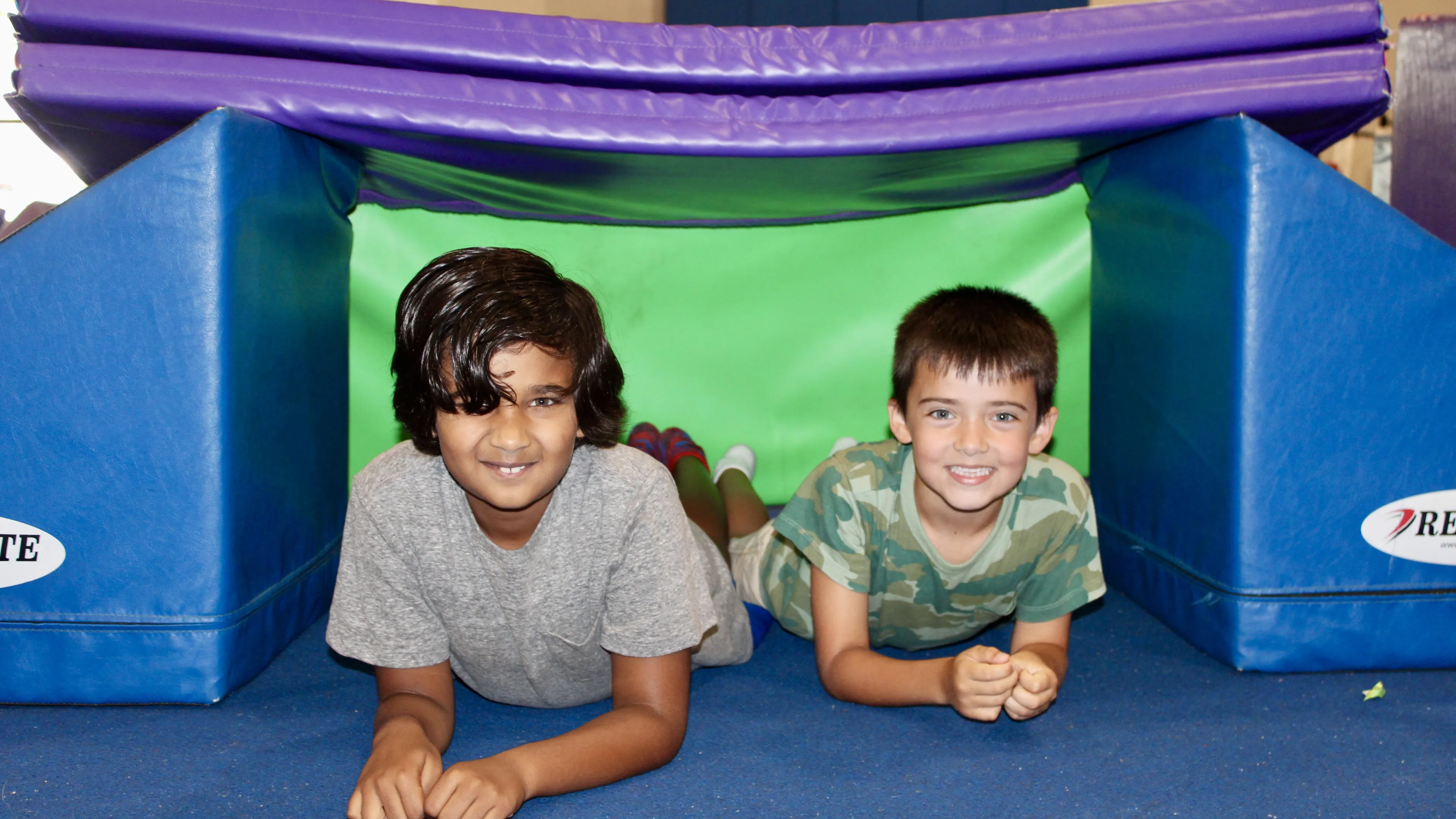 image of two boys on obstacle course