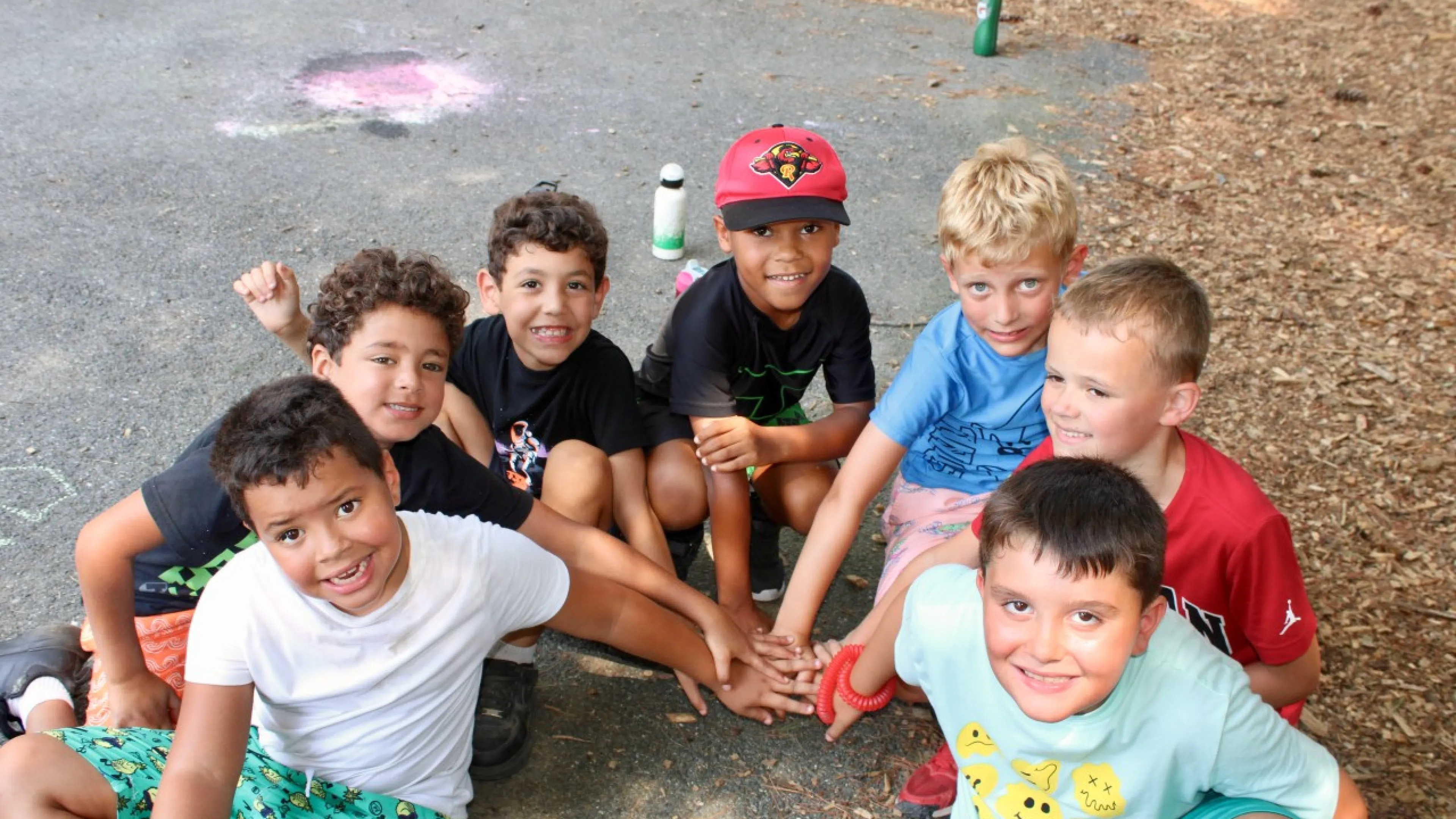 group photo of young boys outside at camp