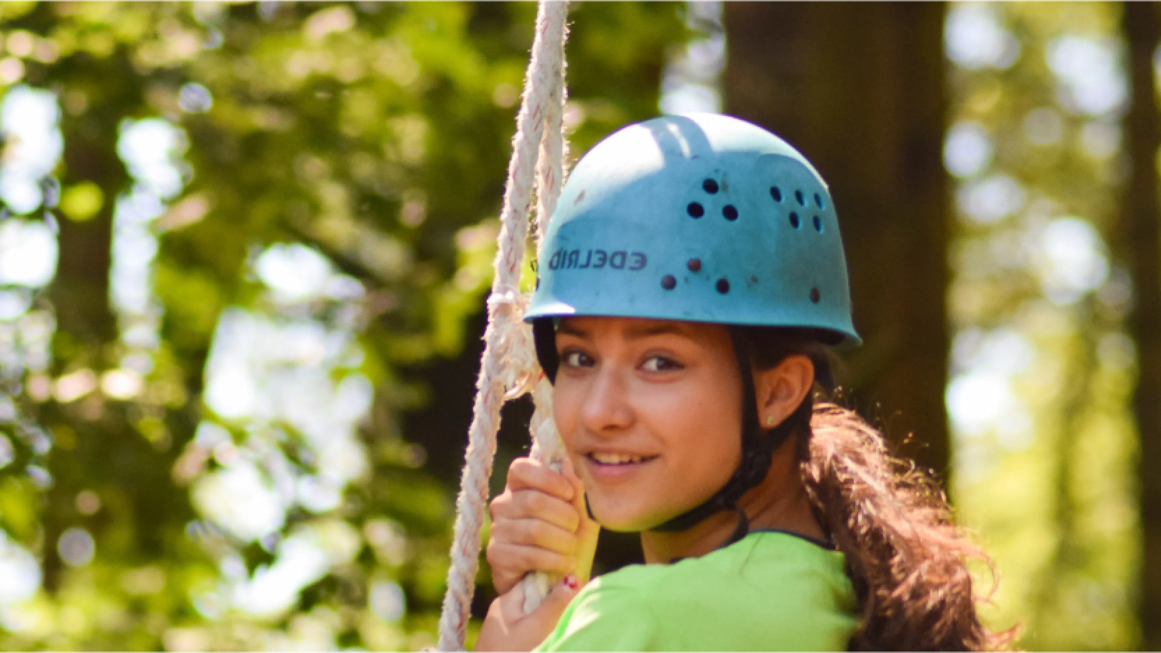 Swing through the tress on our zip line and ropes course