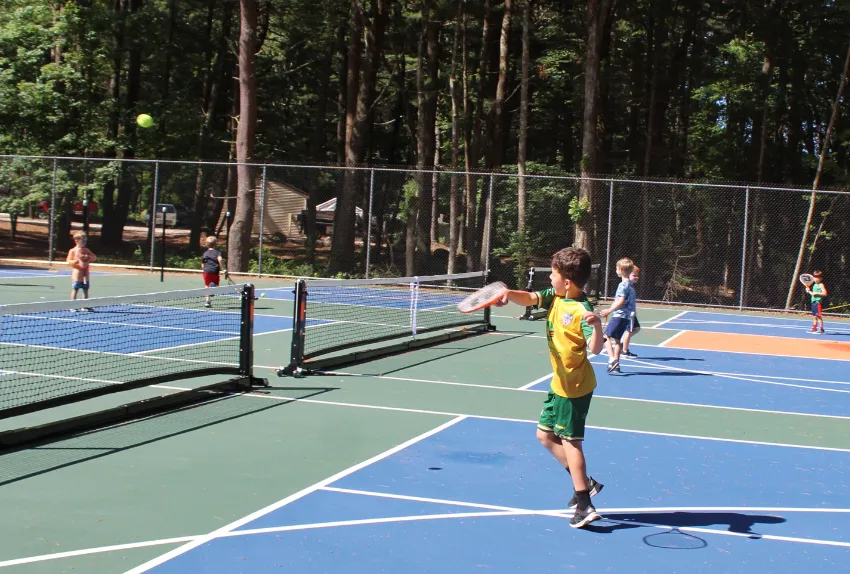 kids playing pickleball outside