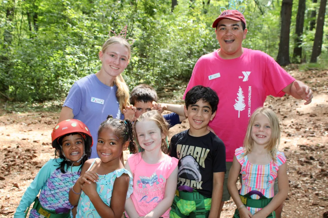 group photo of young campers and two camp counselors