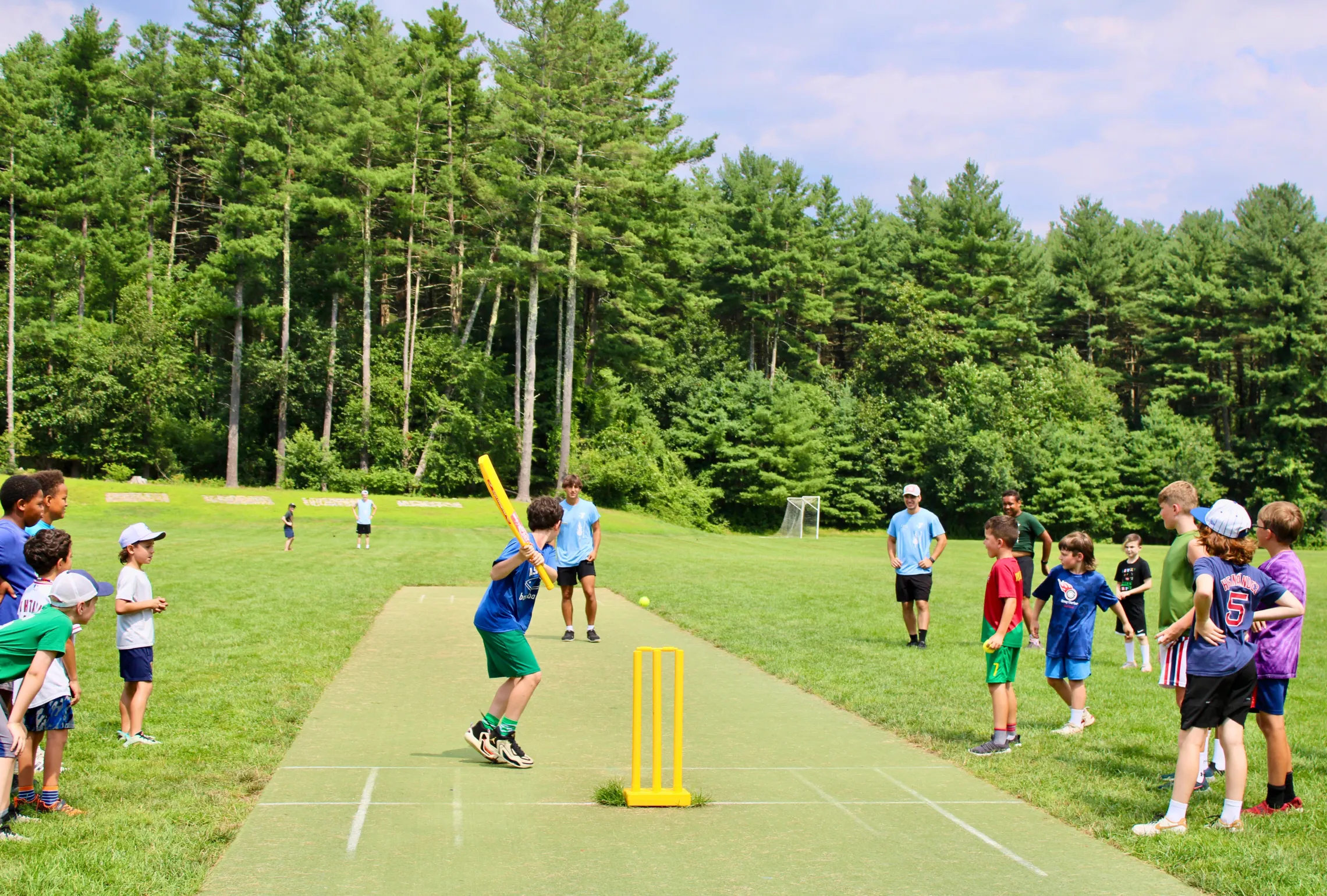 Playing on the cricket pitch st summer camp