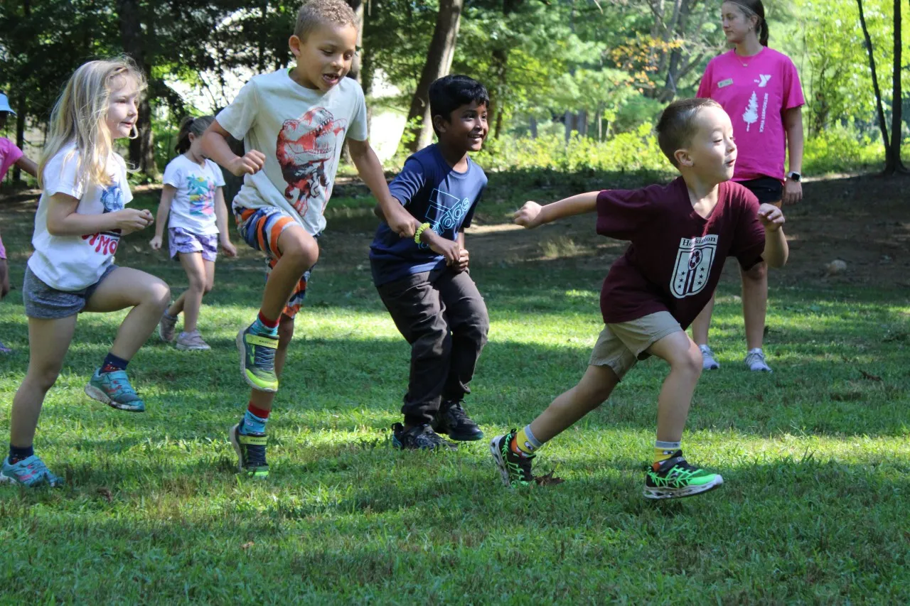 image of young kids running outside