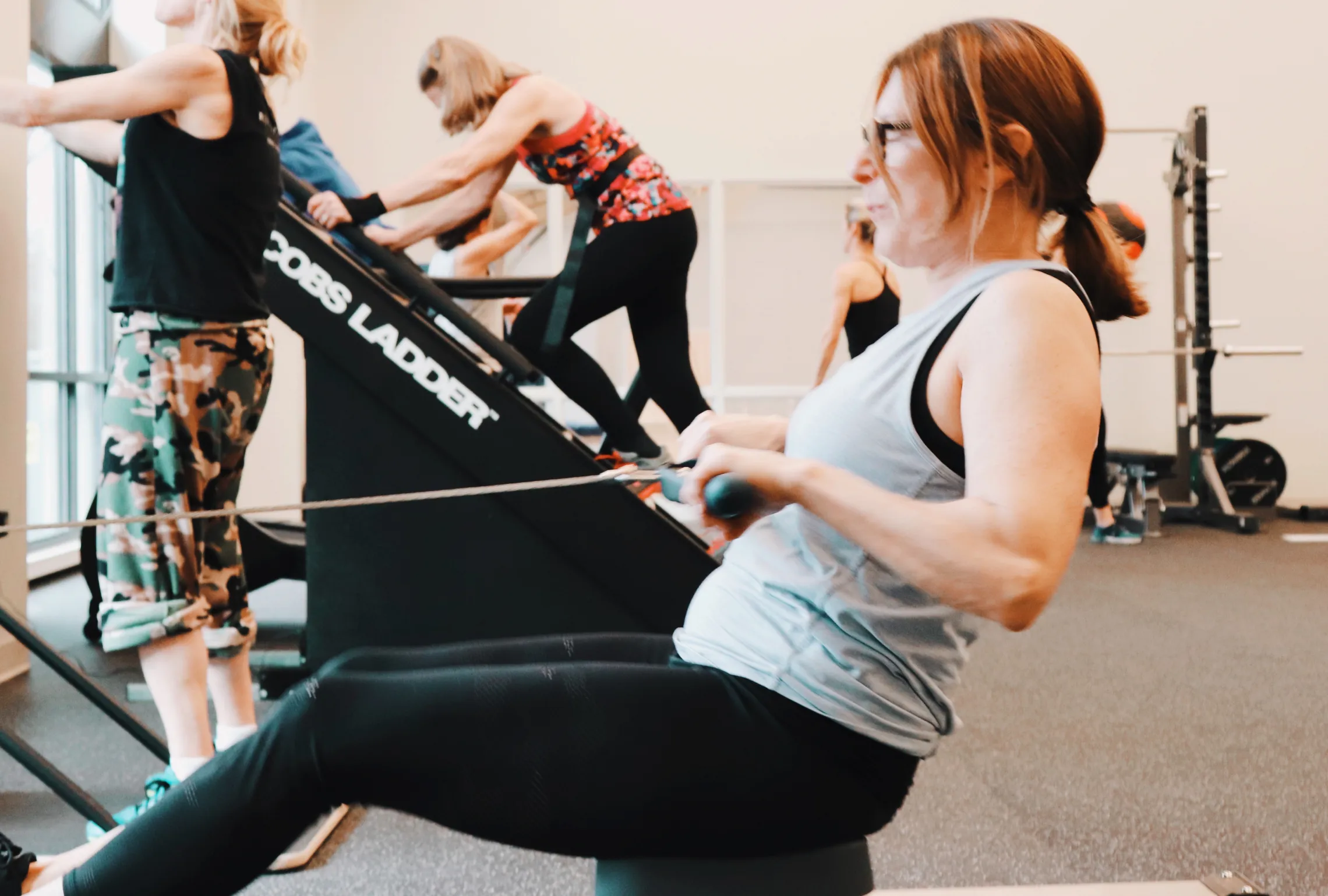 image of woman working out on row machine