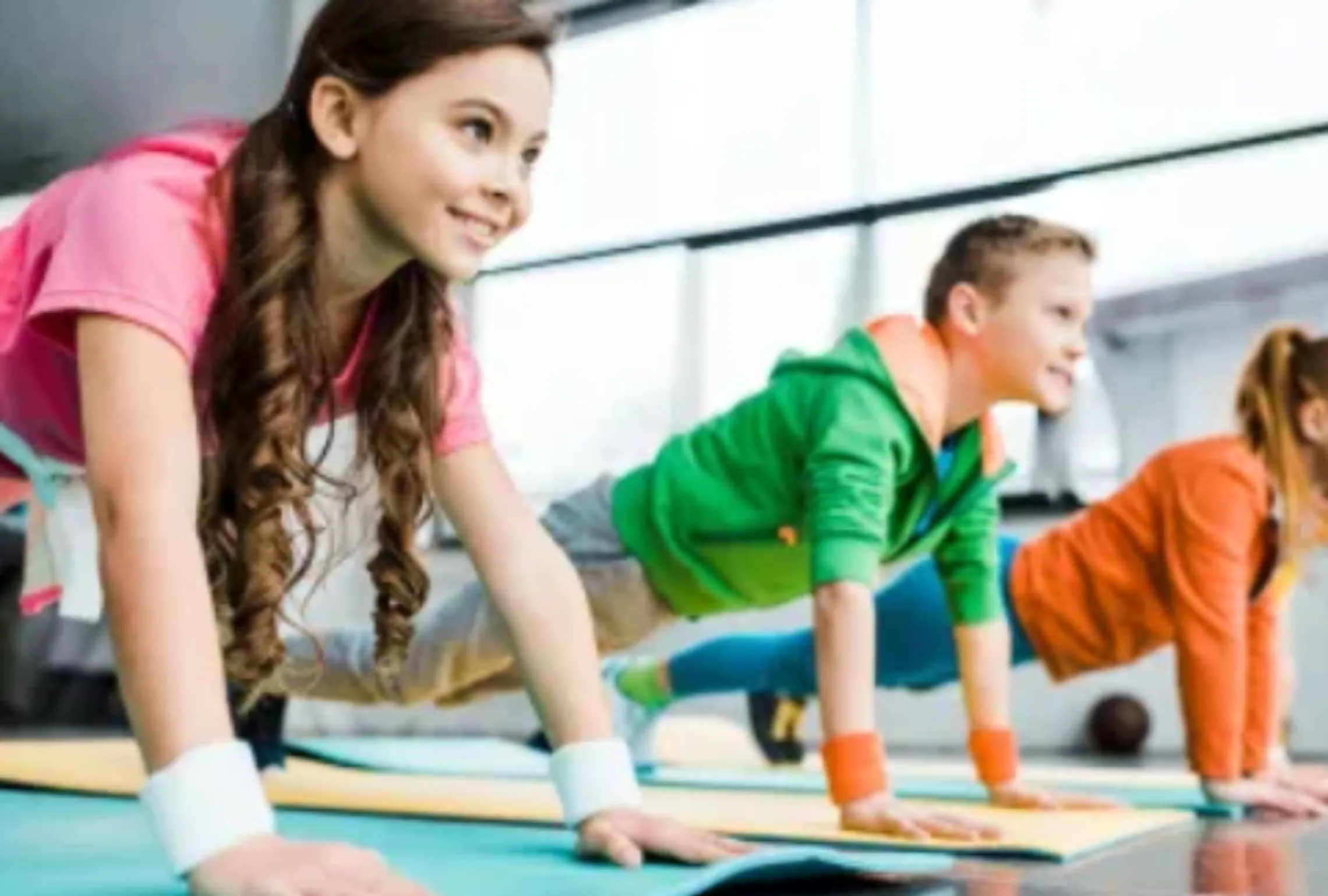 image of youth practicing yoga