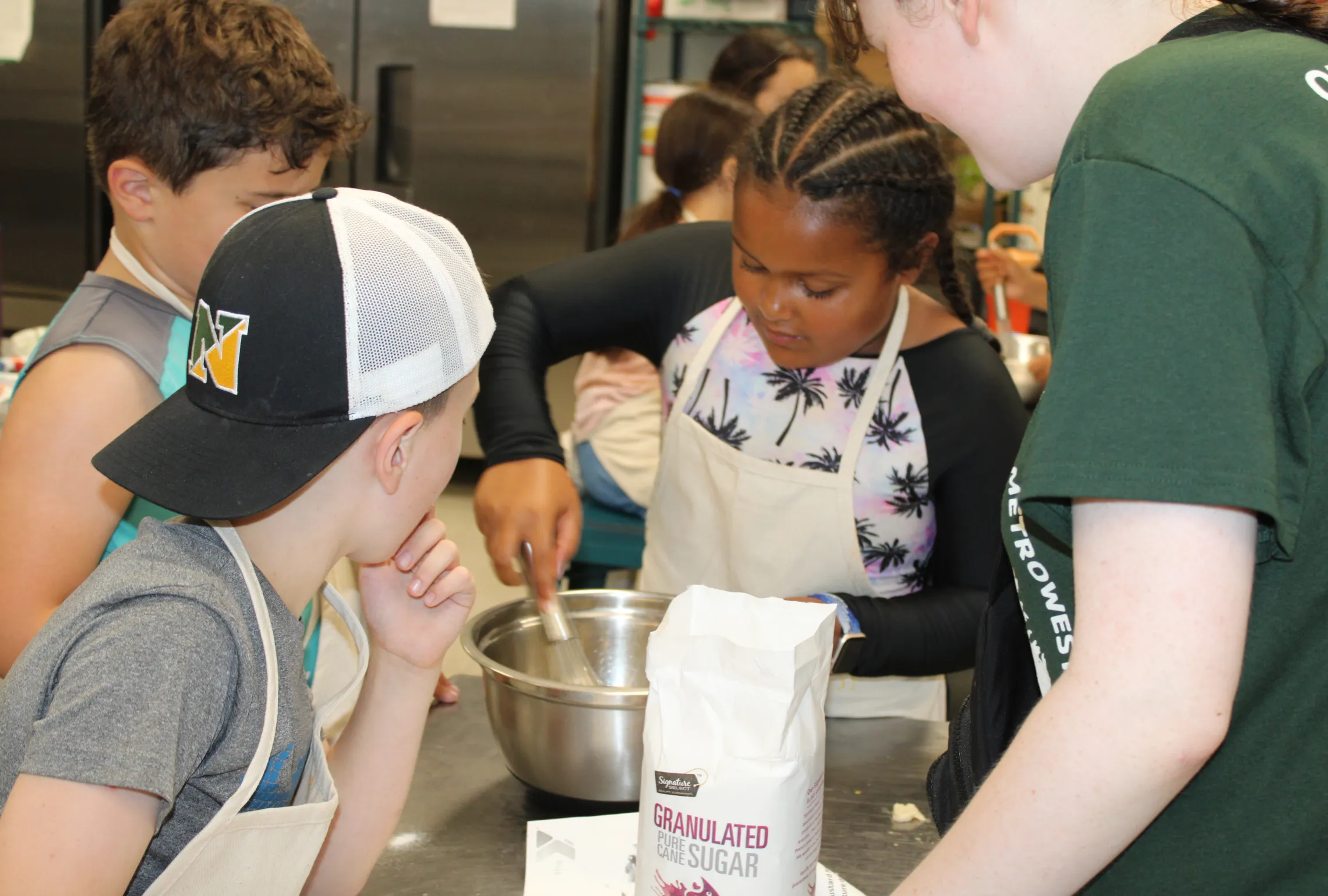 young girl mixing ingredients in a bowl 