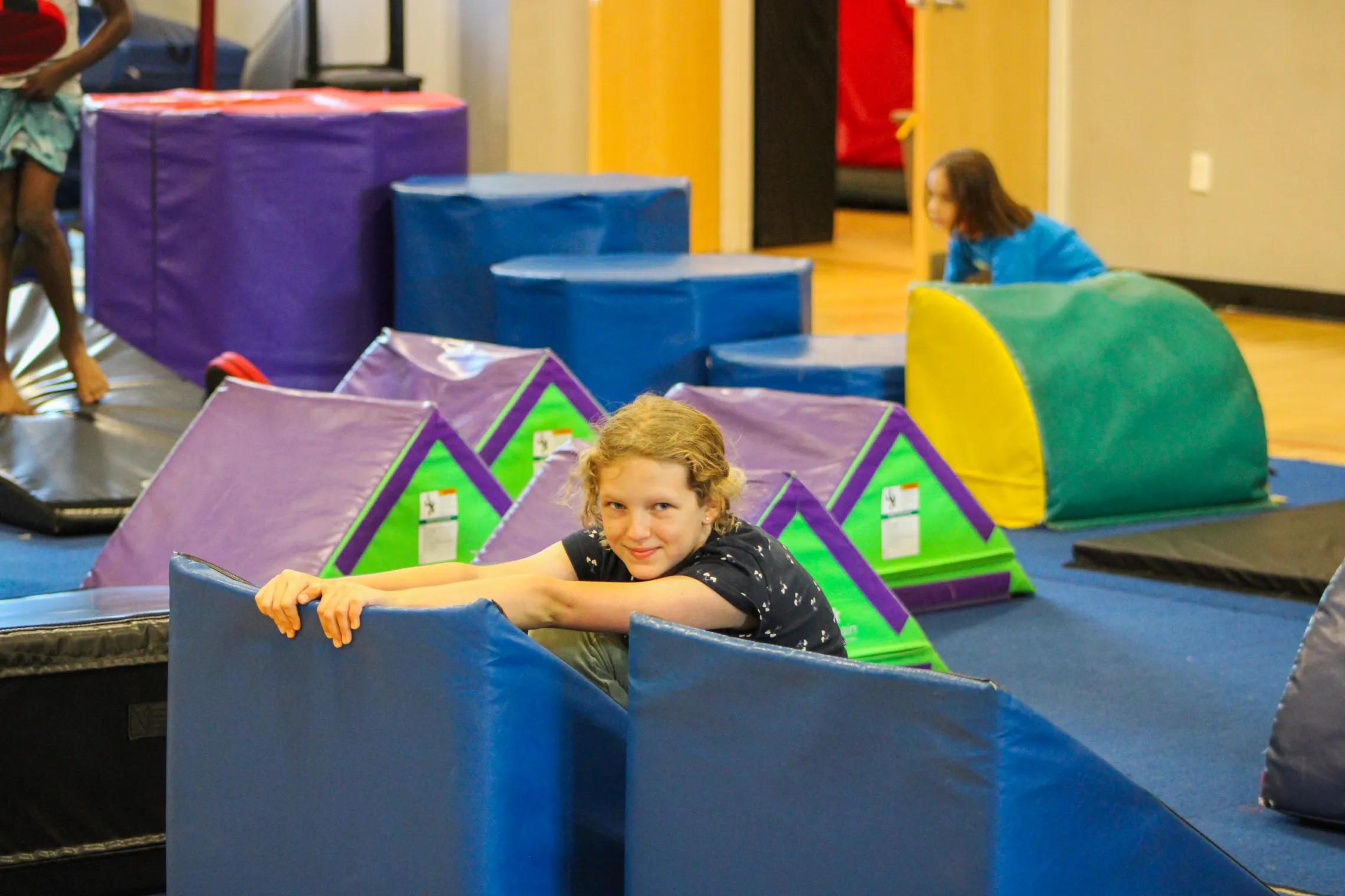 female camper on obstacle course