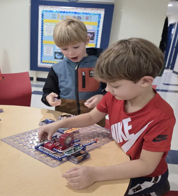 Kids play legos together in our after school program