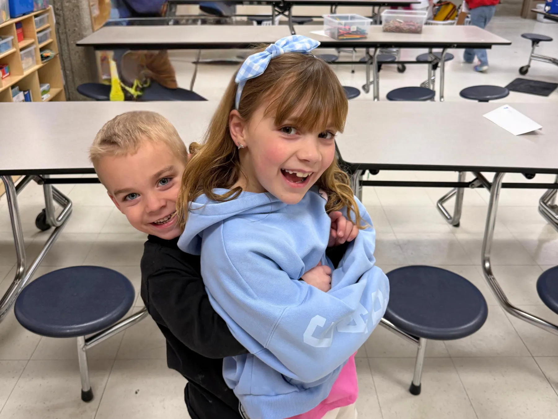 Siblings pose at Ashland's School's Out program