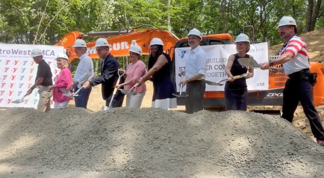 Distinguished Speakers shovel the first earth.