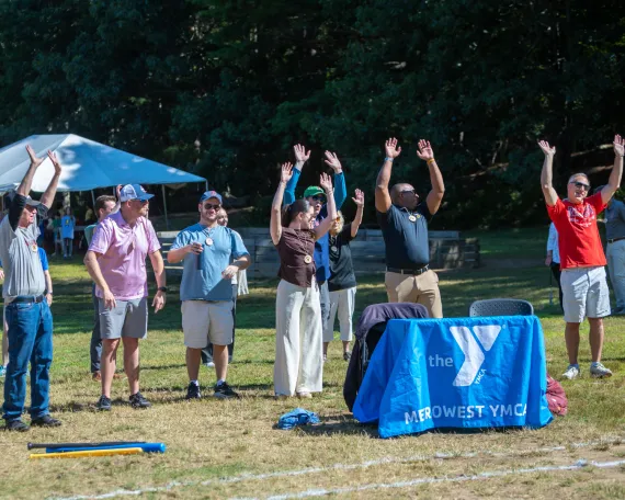 MetroWest Community leaders doing the wave prior to first pitch at Advocacy Day wiffle ball