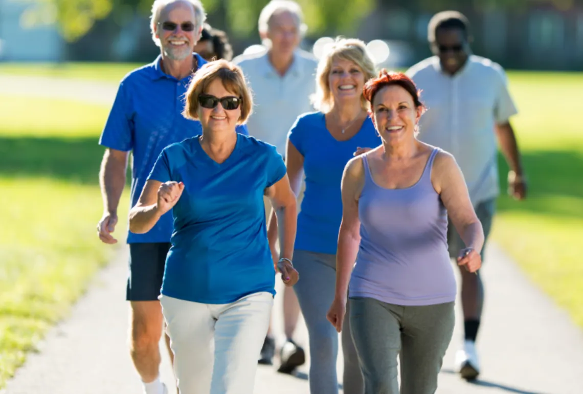 group of older adults walking outside