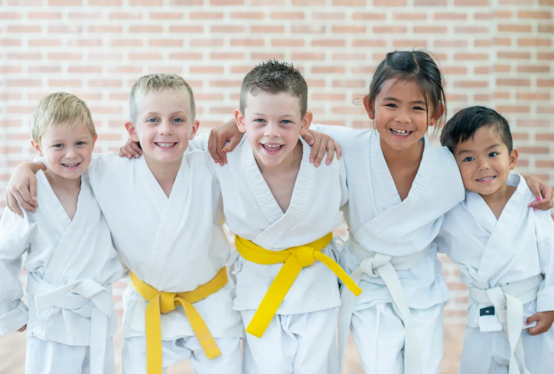 group of kids in karate uniforms