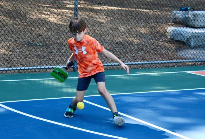 boy playing pickleball