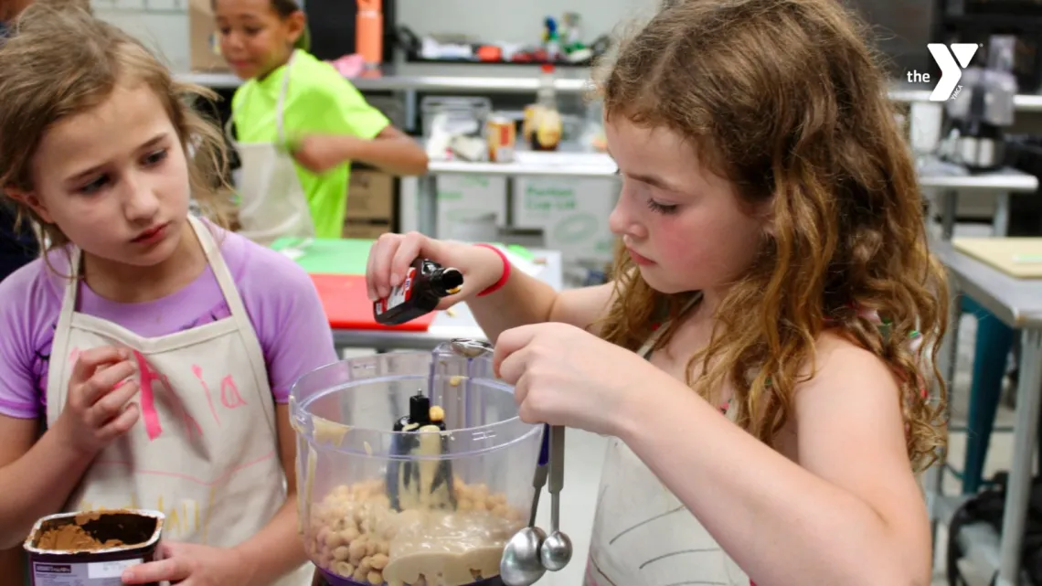 Kids cooking at the MetroWest YMCA Hopkinton Outdoor Center