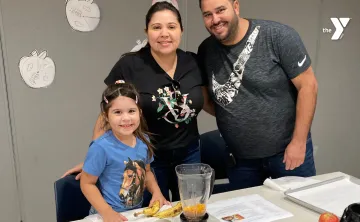 Family cooking together at Cooking with Littles class at MetroWest YMCA Framingham Branch