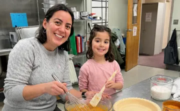 Mother and daughter making pumpkin pie at a MetroWest YMCA Family Dinner Night