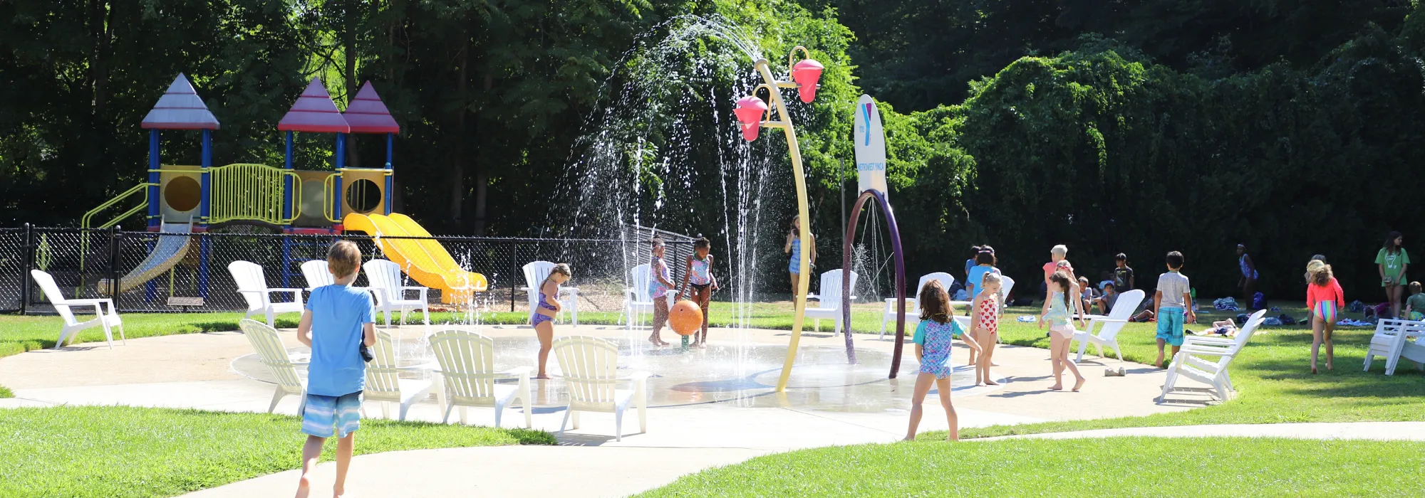 Kids playing in the splash pad at Clearbrook Swim club